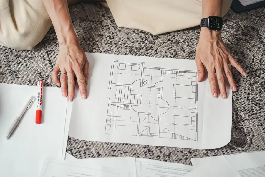 Householder extension plans being checked before a flat to pitched roof conversion in Carlisle