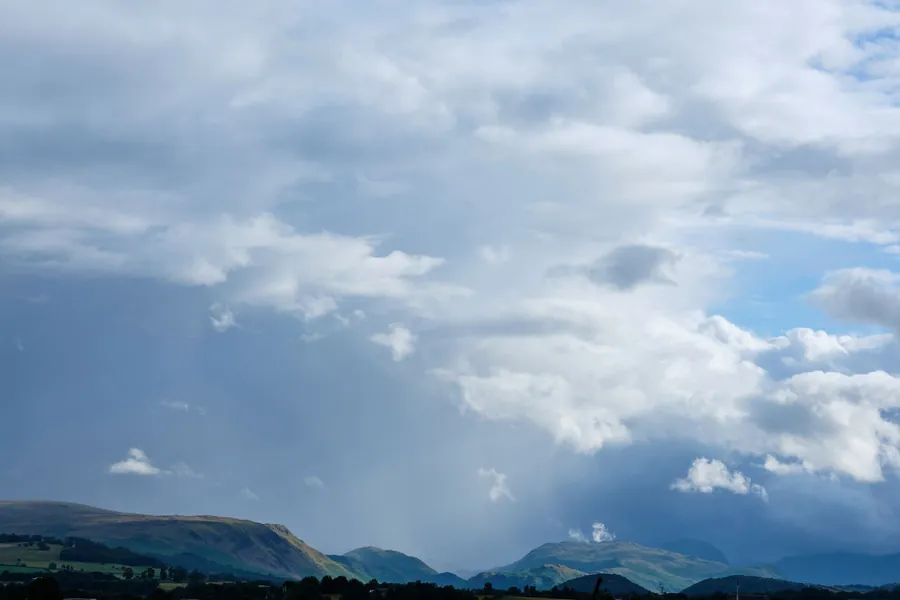 Rain clouds building over the fells on the edge of the Eden Valley near Penrith, the weather that drives water at gable ends and ridges