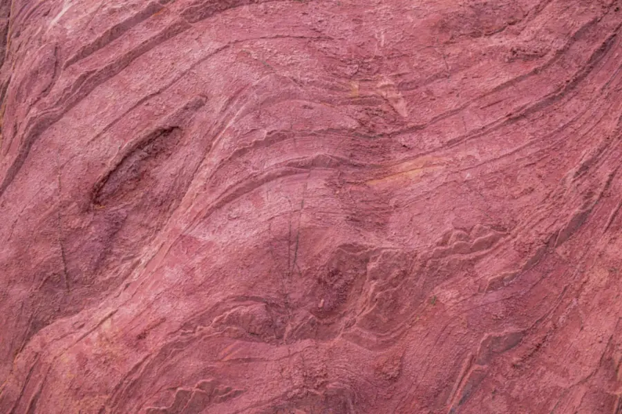 Close-up of layered red sandstone, the soft bedded stone that Brampton's houses, stacks and gable copings are built from