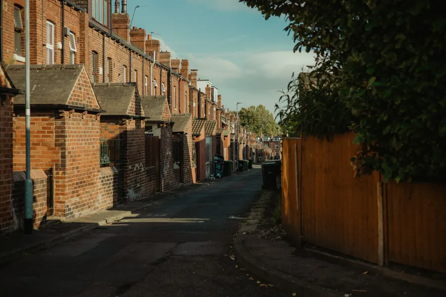 A street of older brick terraced houses with continuous rooflines, the view from which most Carlisle ridge problems are first visible