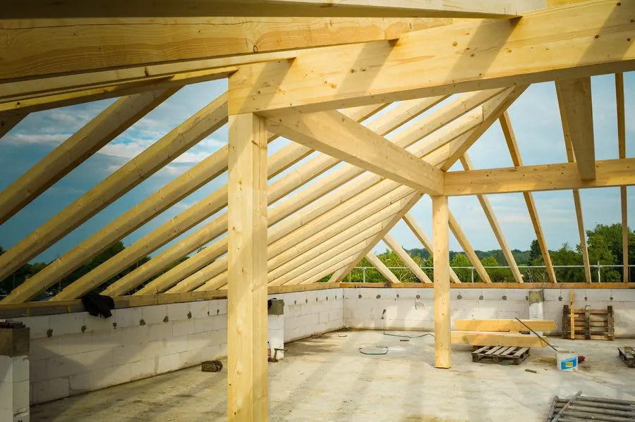 New timber roof structure under construction, the stage at which building regulations apply to roof work in Carlisle