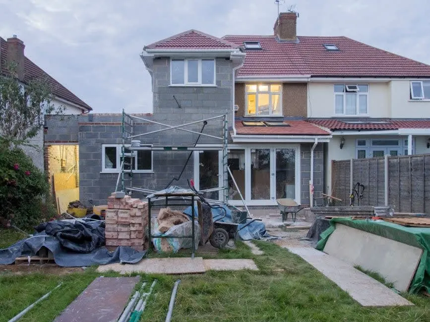 A house extension under construction at the rear of a UK semi, the kind of later addition a Carlisle buyer should ask about