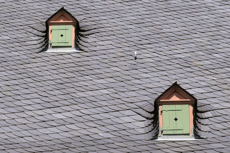 Vents fitted into a slate roof covering to ventilate the space beneath