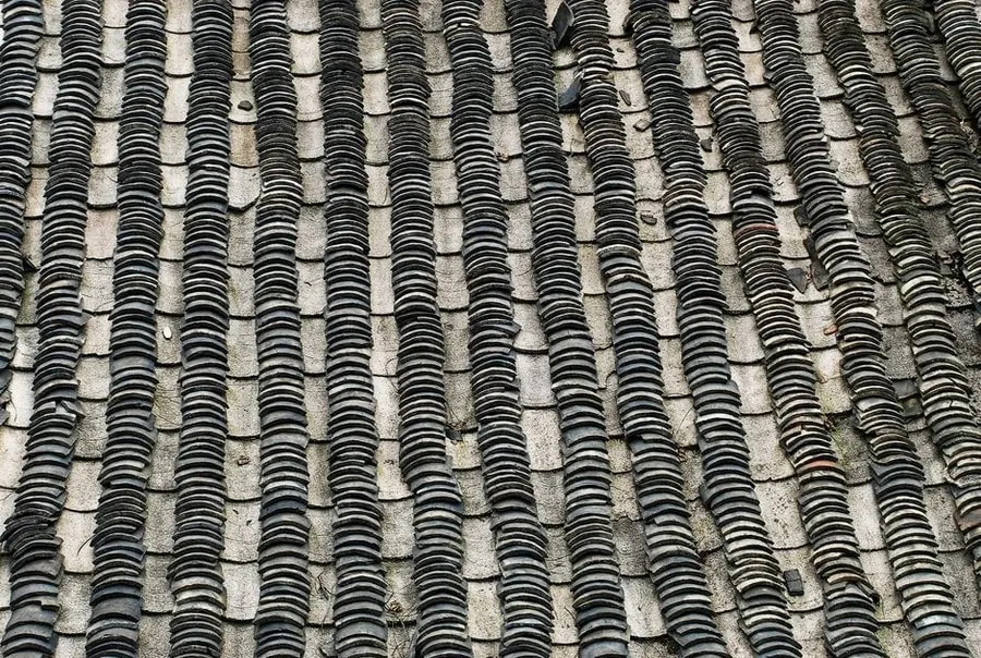 Close-up of a traditional slate roof showing the fixing and lap pattern used on Carlisle properties