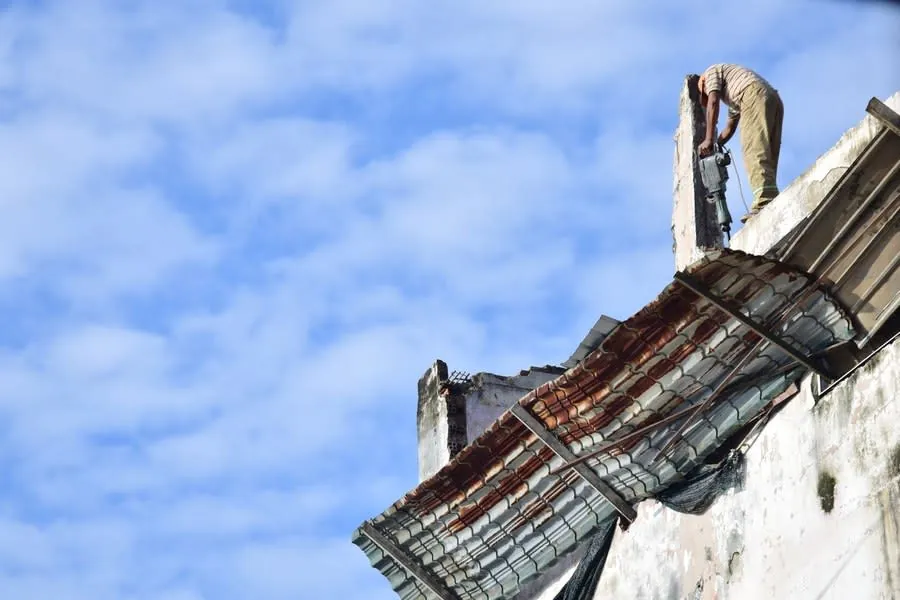 An old roof covering stripped back to the timbers during a re-roof, showing what is underneath before the new covering goes on