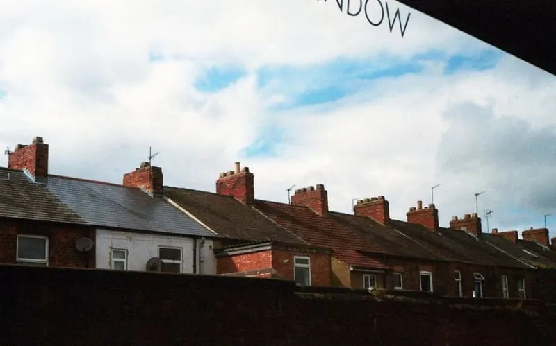Victorian terrace roofline with chimney stacks, the pattern of Wigton's conservation-area streets