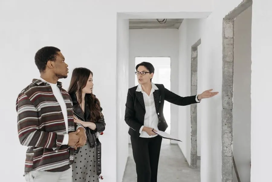 A couple being shown around a property, the point at which the roof is worth asking about in Carlisle