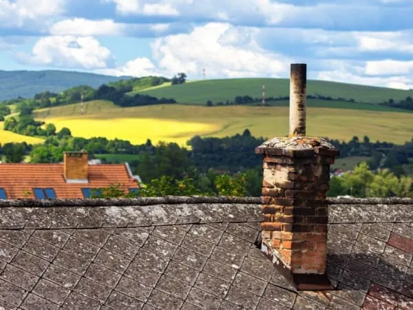 A weathered chimney stack showing eroded joints, common on Brampton's exposed stone stacks
