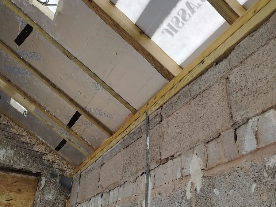 Insulation board fitted between roof rafters on a Carlisle property