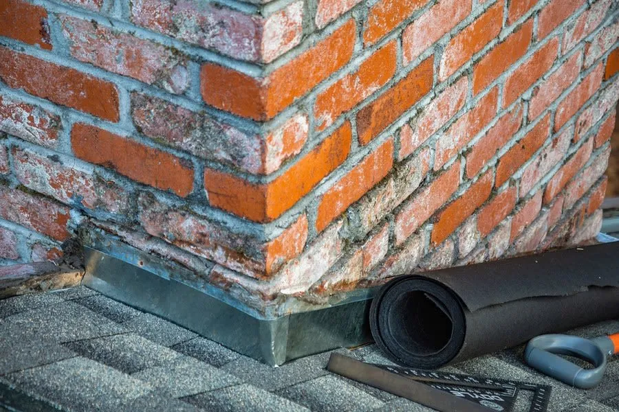 Lead flashing where a chimney stack meets the roof covering on a house in Carlisle