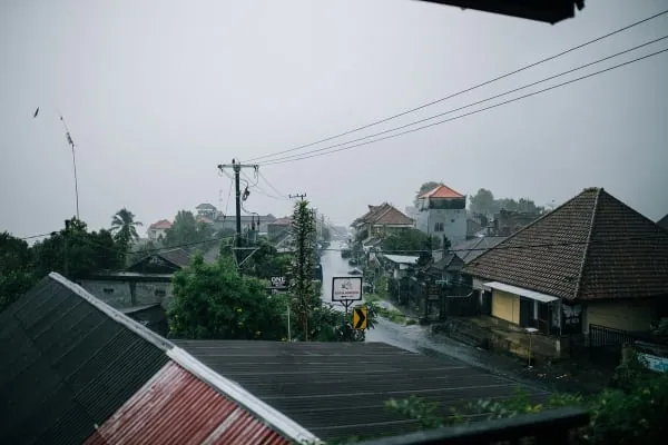 Storm clouds gathering over rooftops, the weather that causes storm damage to Carlisle roofs