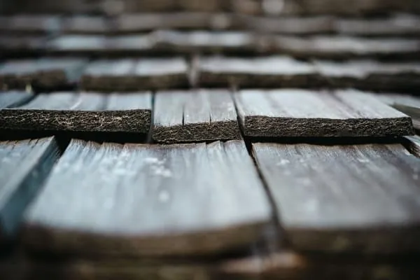 Water sheeting over natural slate, the daily load a Kendal roof's valleys must carry