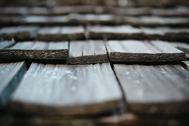 Soaked slate roof covering in Carlisle after a long spell of wind-driven rain