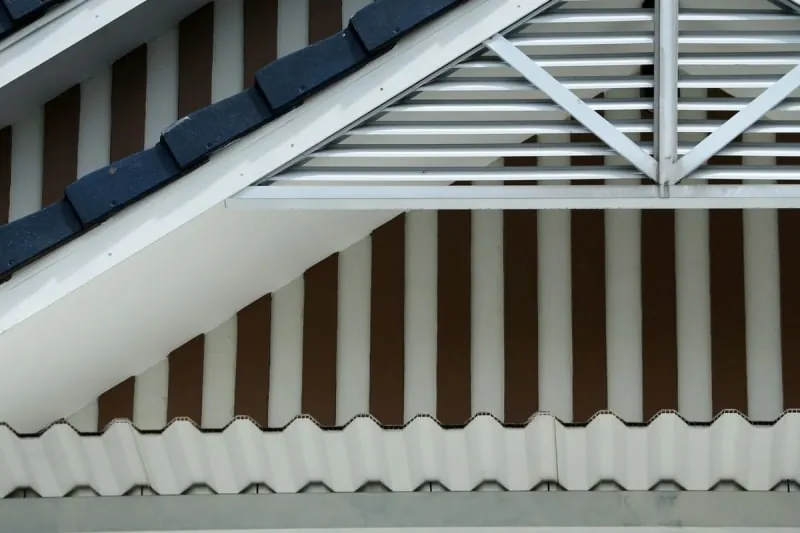 White fascia and soffit boards along the eaves of a house, the roofline joinery Carlisle weather wears out first